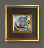 A Favorite framed oil painting featuring a mug and saucer. By artist Jennifer Hansen Rolli.