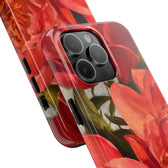 iPhone 15 Pro max phone case close up featuring a red peony painting by artist Jennifer Hansen Rolli.