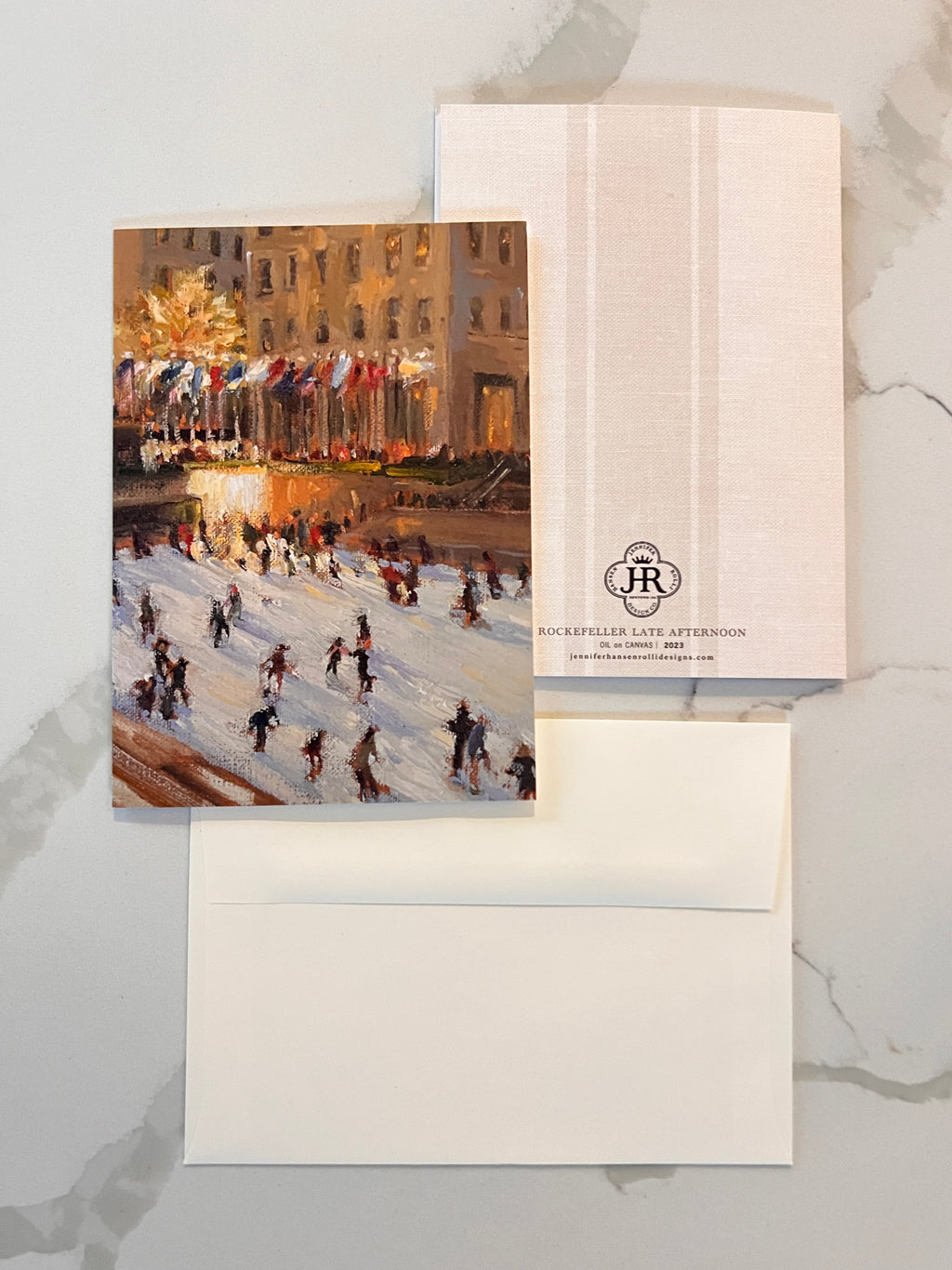 Greeting card with a winter scene of people skating on an ice rink, featuring a envelope with a logo.
