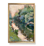 Framed painting of a landscape with trees and water on a white background