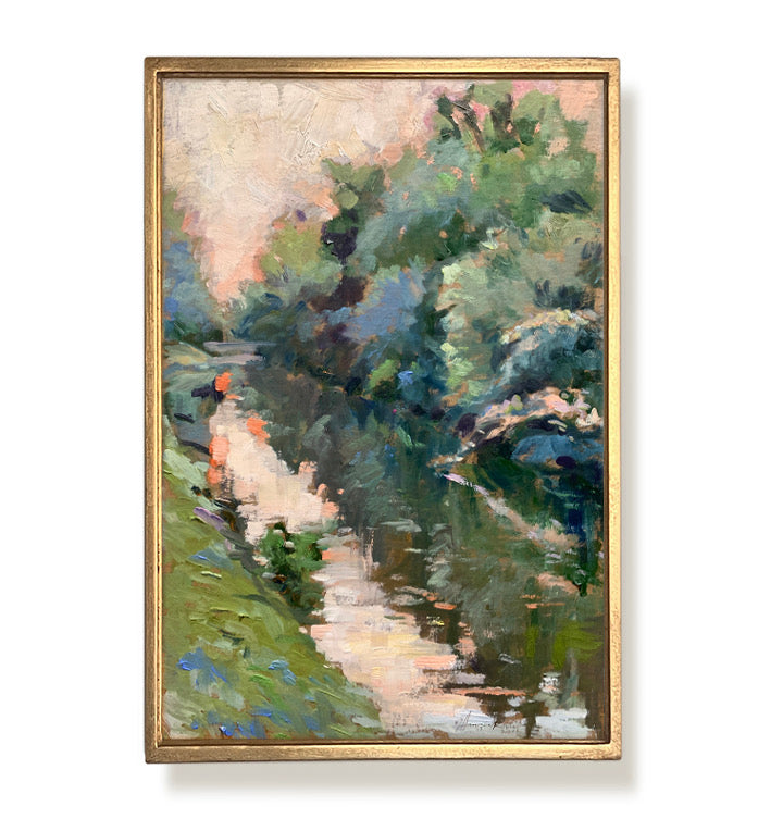 Framed painting of a landscape with trees and water on a white background