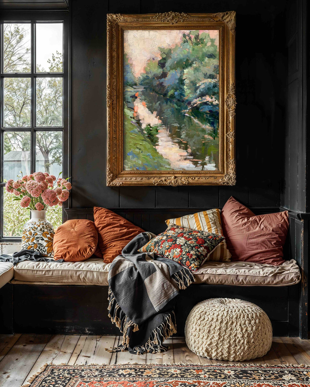 Cozy living room with a window seat, cushions, and a Jennifer Hansen Rolli framed painting on the wall.