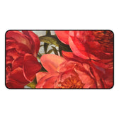 A large desk mat featuring the red peony painting of artist Jennifer Hansen Rolli.