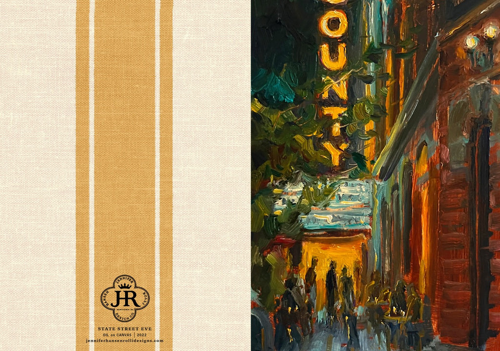 A fabric art print or textile panel featuring a split design: the left side has a cream linen-textured background with two vertical tan stripes and a circular 'State Variety EGG' logo near the bottom, while the right side shows an impressionistic painting of a city street at night with warm yellow signage and red-brown buildings.