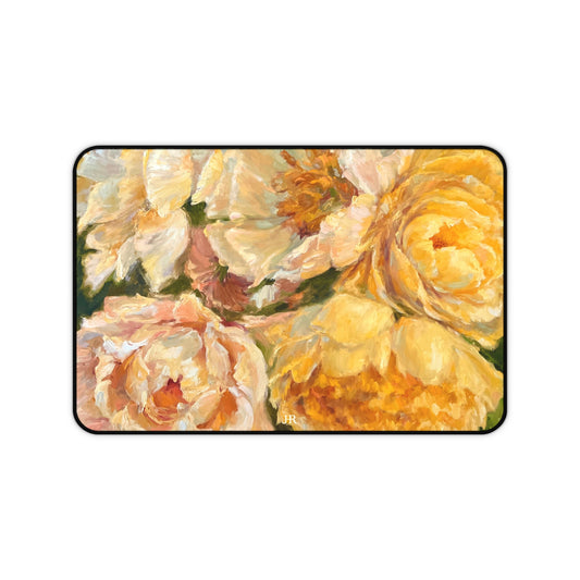 A desk mat featuring the yellow peony painting of artist Jennifer Hansen Rolli.