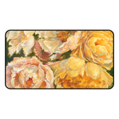 A large desk mat featuring the yellow peony painting of artist Jennifer Hansen Rolli.