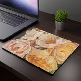 A desk mousepad featuring the yellow peony artwork of artist Jennifer Hansen Rolli.