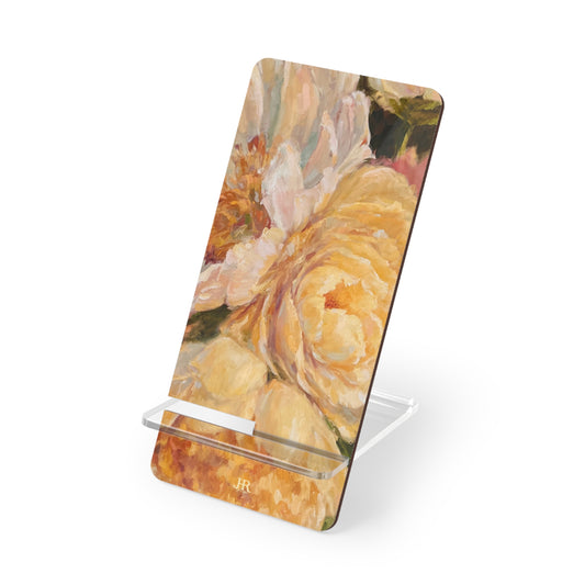 A yellow peony phone stand by artist Jennifer Hansen Rolli.