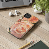 iPhone 15 phone case desk details featuring a pink peony painting by artist Jennifer Hansen Rolli.
